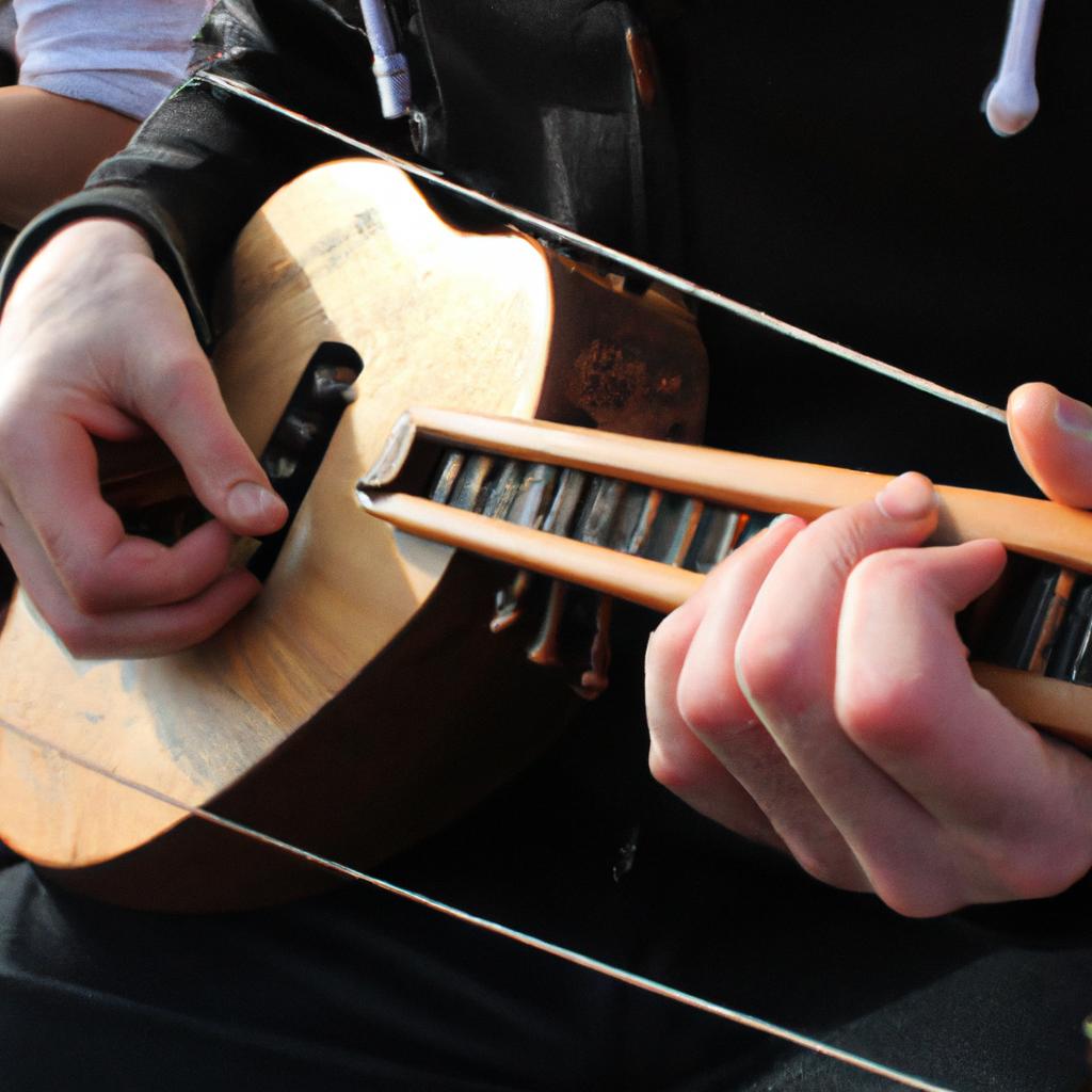 Person playing traditional Irish instrument