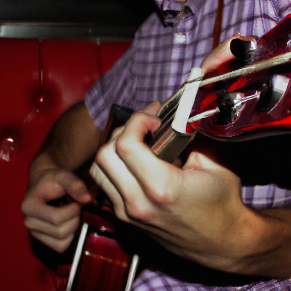 Person playing guitar in pub