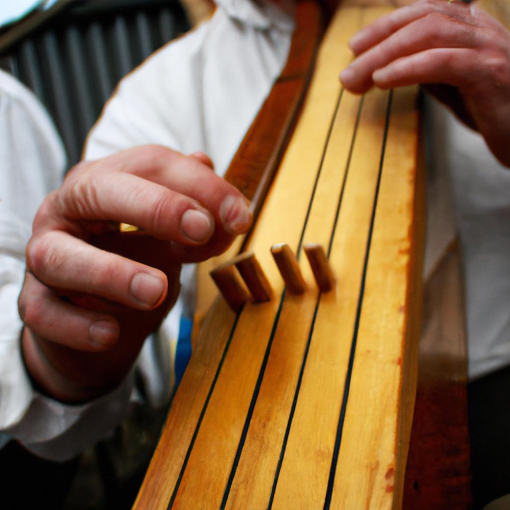 Person playing traditional Irish instrument