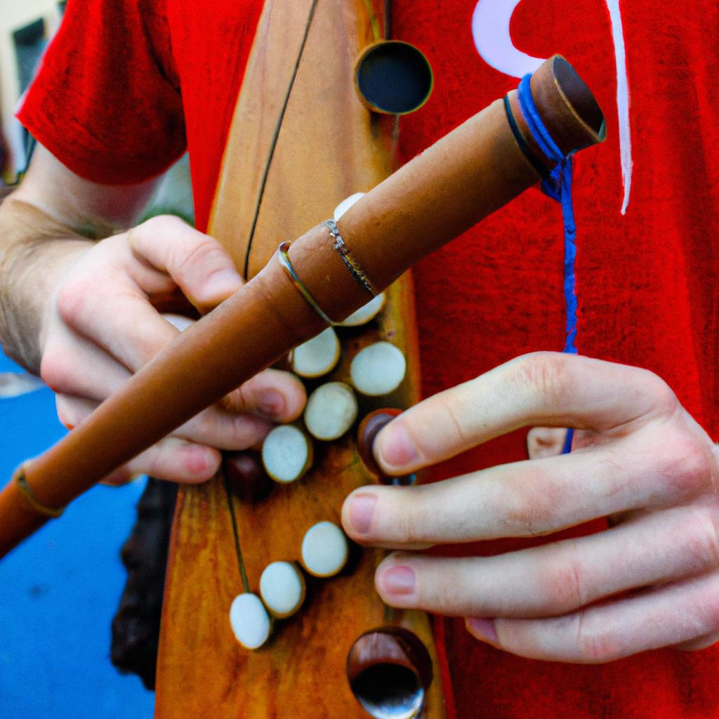 Person playing traditional Irish instrument