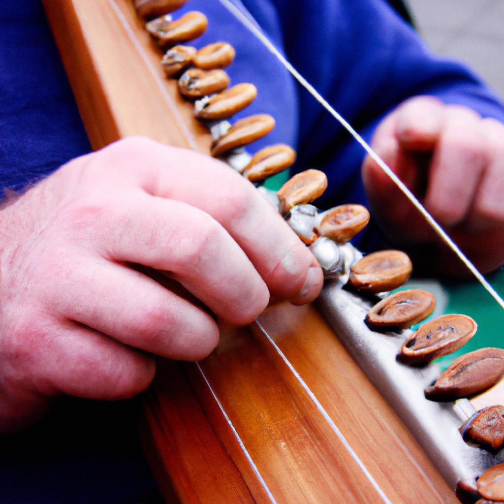 Person playing traditional Irish instrument