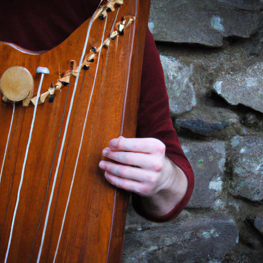 Person playing traditional Irish instrument